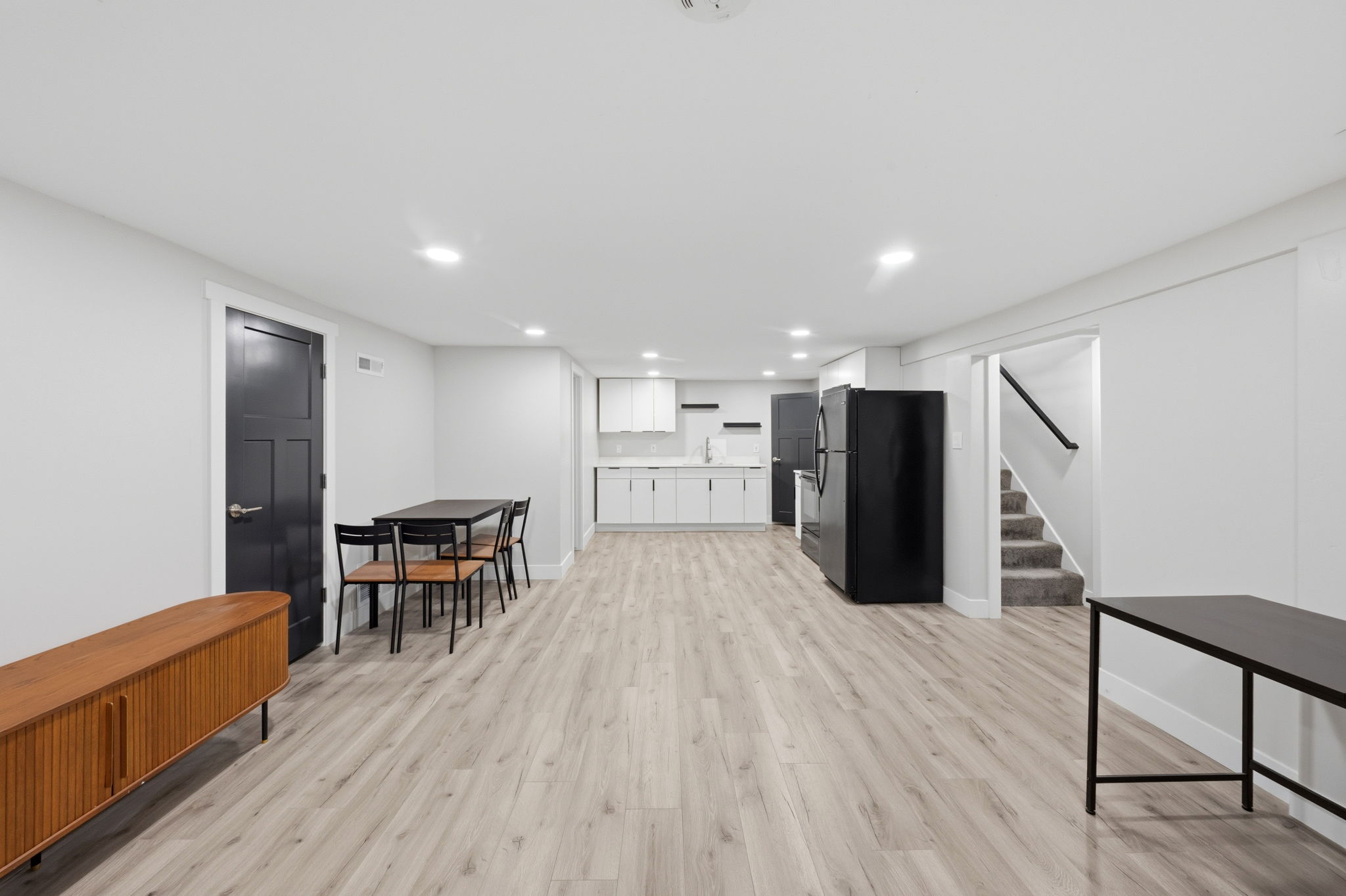 Living room featuring light wood-style floors and recessed lighting