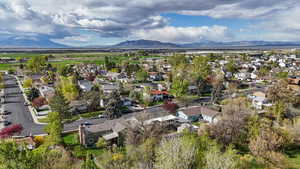 Aerial perspective of suburban area featuring a mountainous background