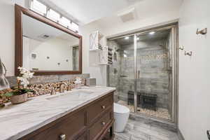 CHECK THIS OUT: full bath, with HEATED FLOOR ,DOUBLE SHOWER HEADS, STEAM SHOWER, and another HEATED Bidet, with a mirror, and a counter top  every young woman will love