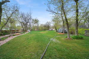 Neighbors back yard and park just over your fence, to enjoy as your view