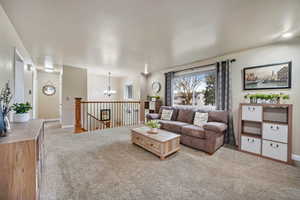 Split Entry works for this home, Living area featuring HUGE window, lighter carpet.