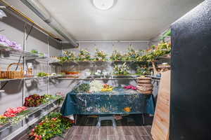 Garage with a floral workspace or your workspace, preparing for 2 weddings in the backyard in June.