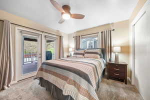 Primary or Master Bedroom , ceiling fan, and French doors to BIG DECK out back.