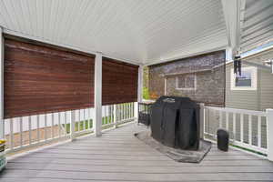 BLINDS DOWN... Deck with area for grilling with blinds for more shade