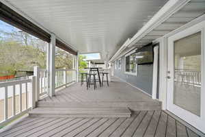 BIG DECK EXSTENDS the full length of the house... now that's a BIG DECK. Seller could leave the TV AGAIN with a good offer. BLIND UP