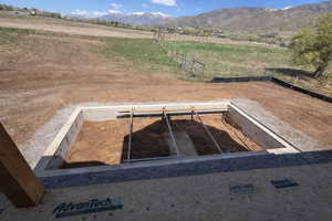 View of yard with a mountain view and a rural view