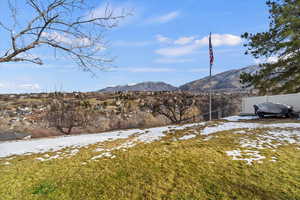 View of both valley and mountains, flag pole