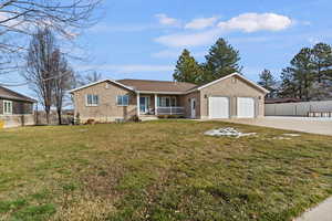 Ranch-style home with brick, driveway, a garage, and a porch