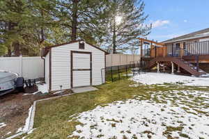 Storage shed, fence, and a deck