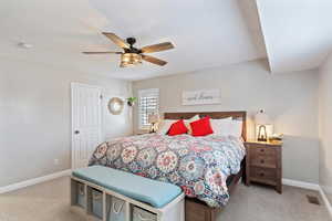 Bedroom featuring a ceiling fan and light colored carpet