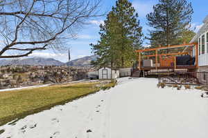 Backyard deck with both valley and mountain view,  a shed too