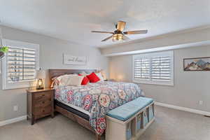 Bedroom featuring carpet floors and a ceiling fan