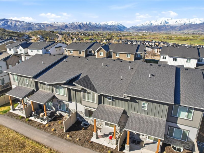 Aerial view of residential area featuring a mountainous background