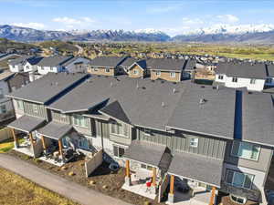 Aerial view of residential area featuring a mountainous background