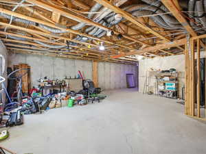 View of unfinished basement plumbed for bathroom