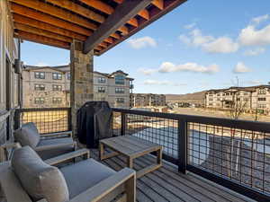 Balcony featuring area for grilling