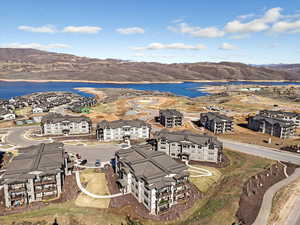 Aerial view of residential area featuring a water and mountain view