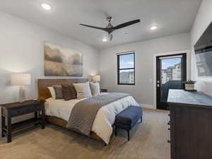 Bedroom with access to outside, light colored carpet, a ceiling fan, and recessed lighting