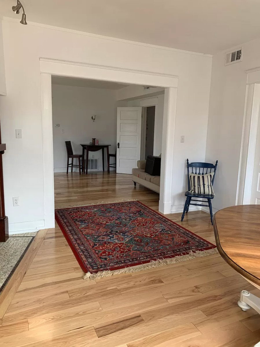 Living area featuring light wood finished floors and baseboards