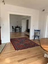 Living area featuring light wood finished floors and baseboards