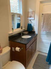 Bathroom featuring vanity and light tile patterned floors