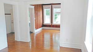 Spare room with light wood-type flooring and baseboards
