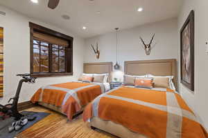Queen Guest Bedroom featuring recessed lighting, ceiling fan, and wood finished floors