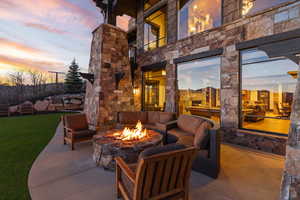 Patio / terrace featuring a patio and an outdoor living space with a fire pit
