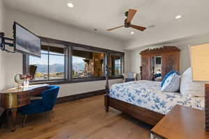 Blue bedroom Bedroom with hardwood / wood-style flooring, multiple windows, recessed lighting, and a ceiling fan