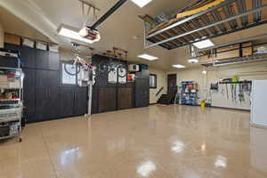 3 car heated garage with cabinet storage