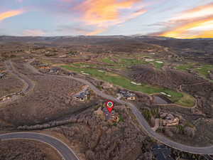 Aerial view at dusk of a mountain view and view of golf course