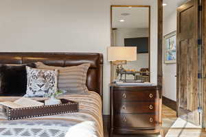 Bear Bedroom with wood finished floors and recessed lighting