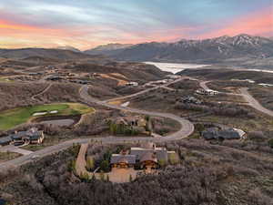 Aerial view of a water and mountain view and a golf course