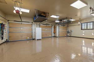 3 car heated garage with storage racks