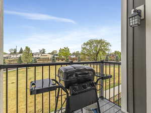 Balcony with area for grilling and a residential view