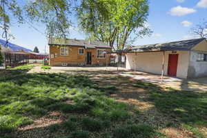 Back of house featuring a patio and brick siding