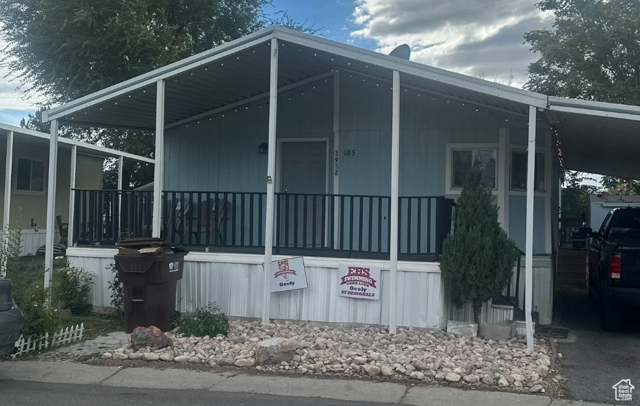 View of side of property with an attached carport