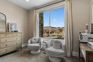 Sitting room featuring baseboards and recessed lighting
