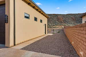 View of side of home featuring a mountain view