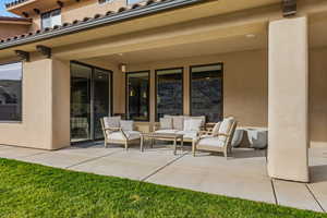 View of patio with outdoor furniture