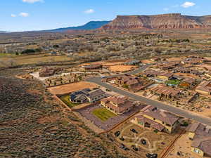 Aerial perspective of suburban area featuring a mountainous background