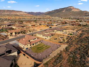 View of property location featuring nearby suburban area and a mountain backdrop