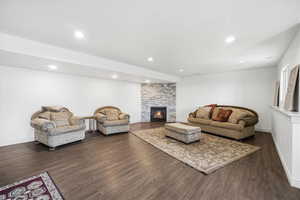 Spacious living area featuring a fireplace and recessed lighting