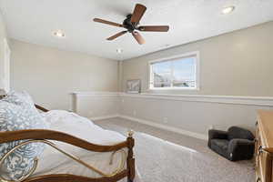 Bedroom #3 with carpet floors, ceiling fan, recessed lighting, and a textured ceiling