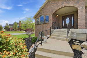 Entrance to property with brick siding