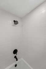 Full bathroom with shower / washtub combination