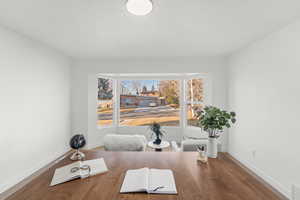 Office featuring baseboards and wood finished floors