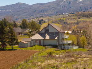 View of front of house featuring a metal roof and a mountain view
