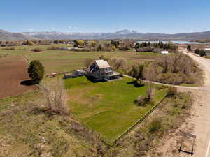 Overview of rural landscape featuring a mountain backdrop