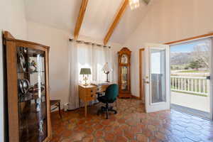 Office featuring vaulted ceiling and a mountain view
